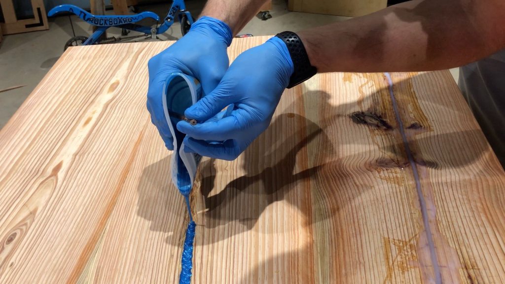epoxy resin river pour with blue metallic pigment
