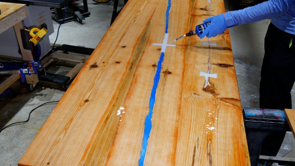 how to make a rustic table with epoxy resin - flood coat torch to remove bubbles