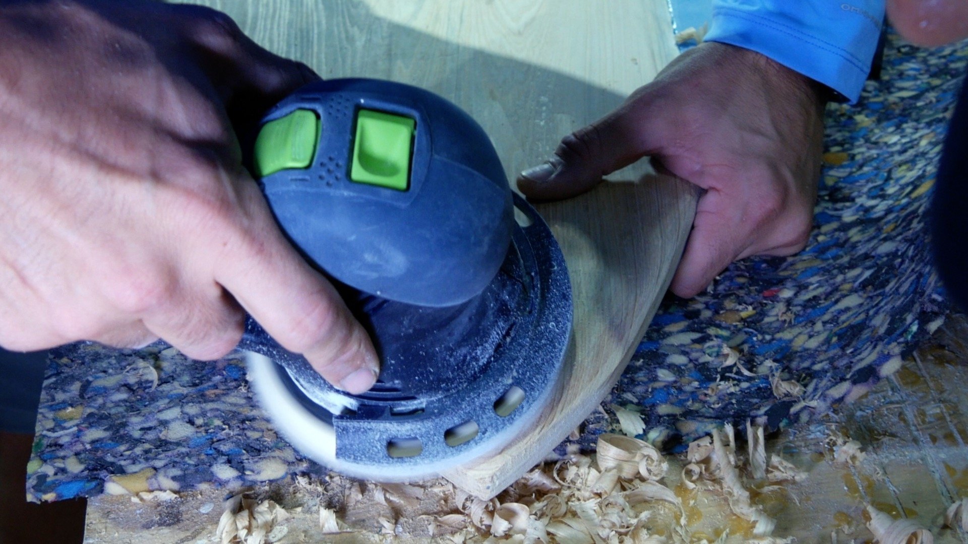 how to make wood and resin wall art that glows - surfboard shaping with rotary sander