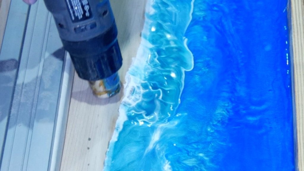 heat gun to remove bubbles and blend resin ocean waves