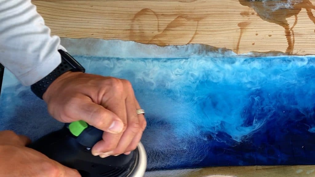 sanding resin ocean wave art with Festool RO125